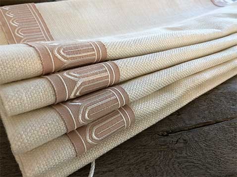 a pile of folded, beige fabric